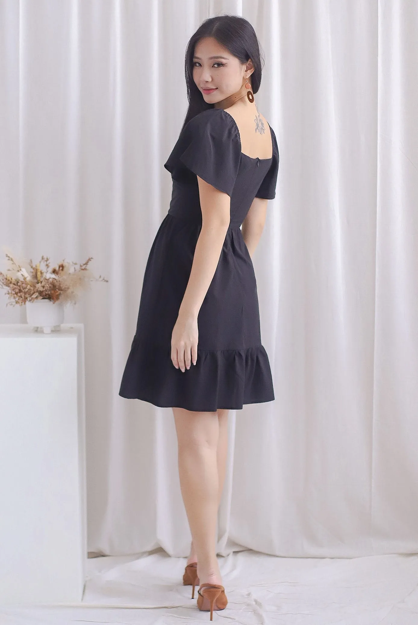 Aenor Bustier Sleeved Ruffle Romper Dress In Black
