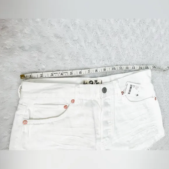 NWT- WE THE FREE Loving Good Vibrations Distressed Denim Shorts Spring White