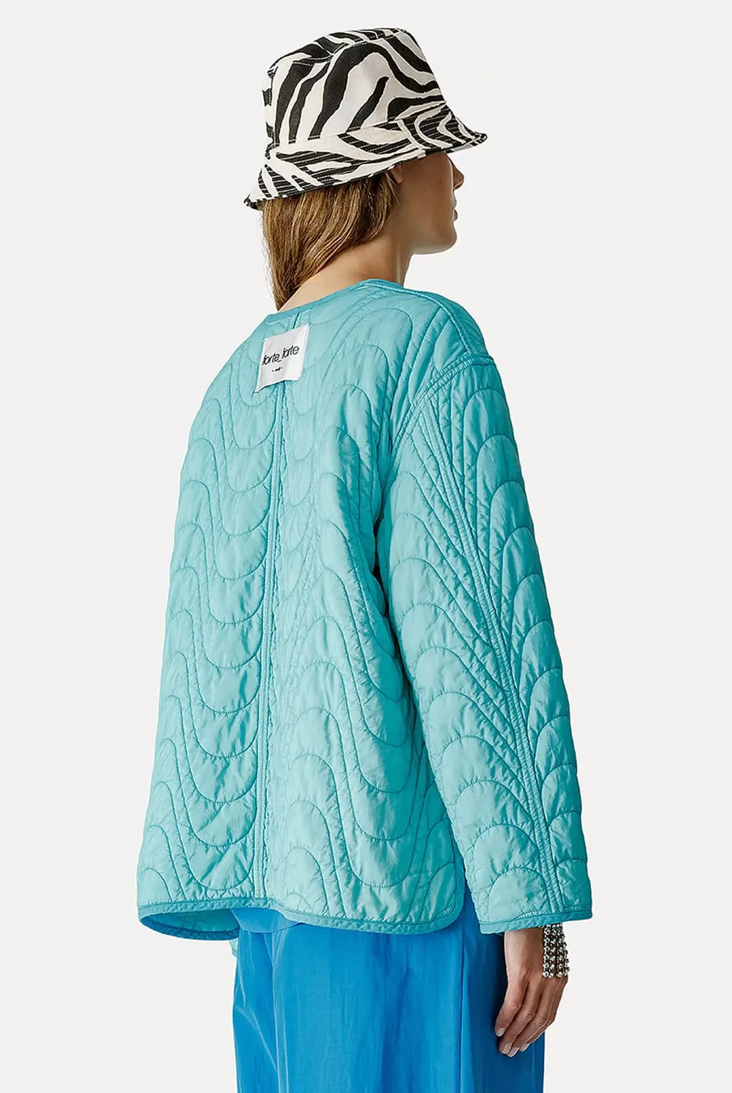 Reversible matelassé bomber jacket