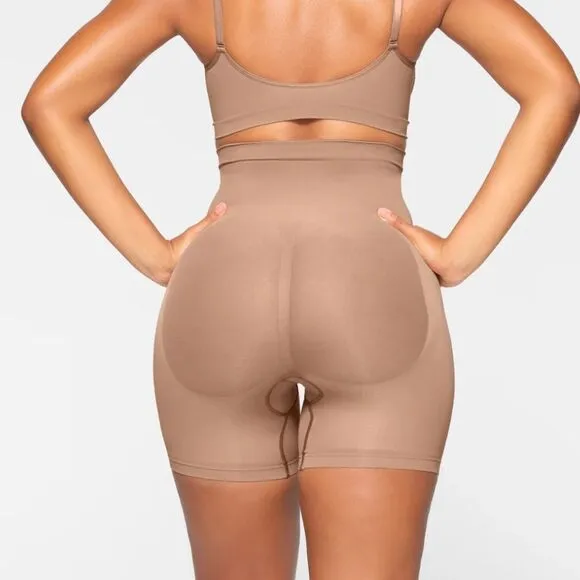 SKIMS Sculpt Seamless Shaping Mid Thigh High Waisted Shorts In Umber